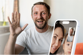 Man waving at his family in a video call